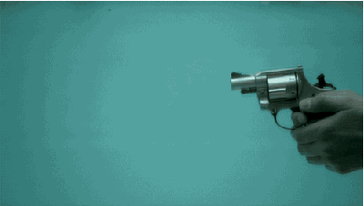 A revolver being shot underwater