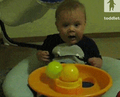 Baby amazed at balls