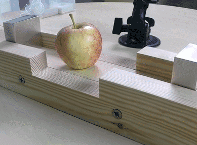 Powerful magnets crushing an apple