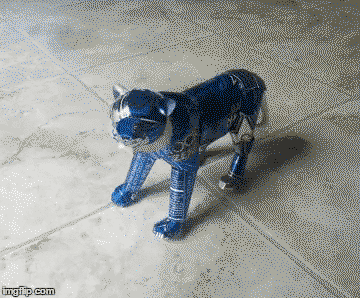 Blue tiger sculpture made out of soda cans
