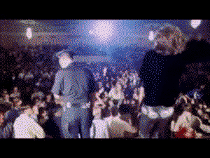 Jim Morrison catching a necklace from the crowd