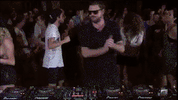 DJ accidentally dances in perfect sync with girl behind him