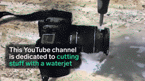 Powerful water jet perfectly cuts through camera