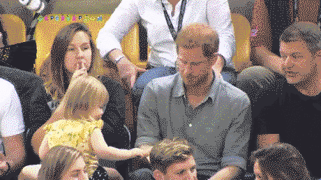 Prince Harry and a baby and a popcorn
