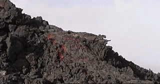 Man runs up a lava flow