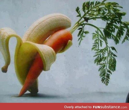 A banana, tenderly holding a carrot