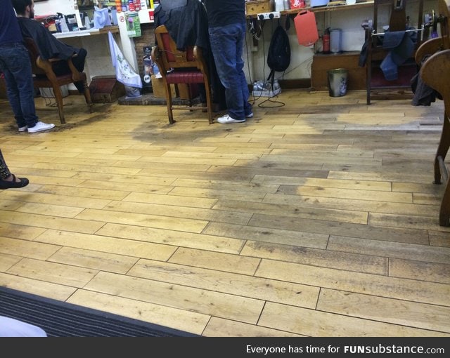 Barbershop floor worn away after decades of barbering