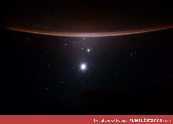 Astronaut Scott Kelly captures a Earth/Moon/Venus/Jupiter alignment from the ISS