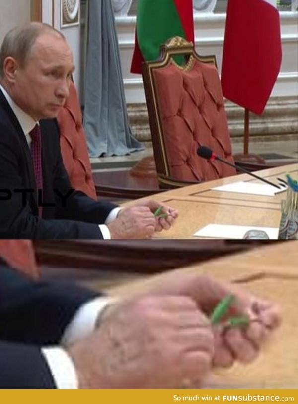 President Vladimir Putin snapping a pencil in half during the peace negotiations