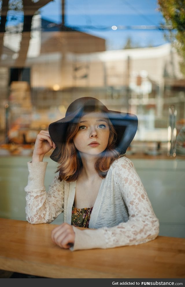 Girl behind a cafe window