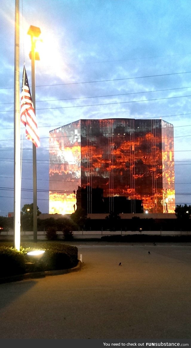 A sunset reflecting off of a building