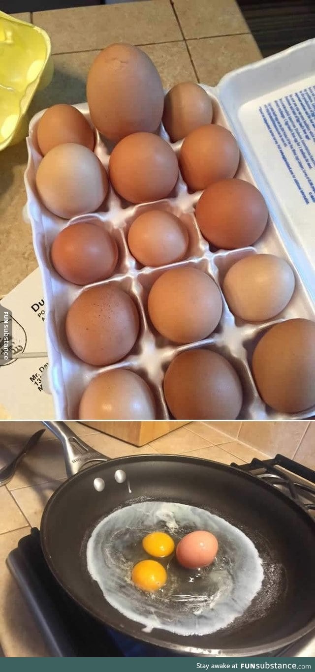 A monster egg with a double yolk and another whole egg inside