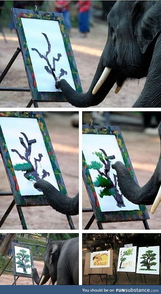 Elephant painting a tree