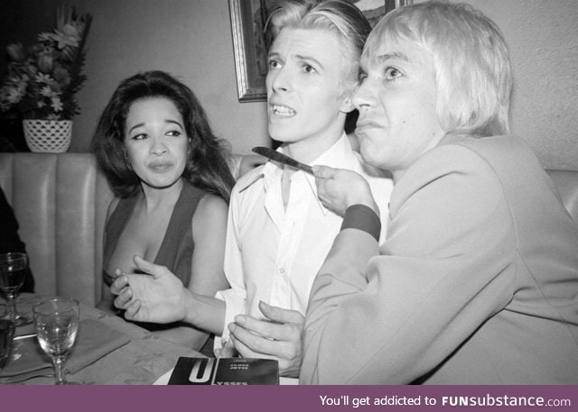 Iggy Pop holding a knife to David Bowie's throat, 1976.