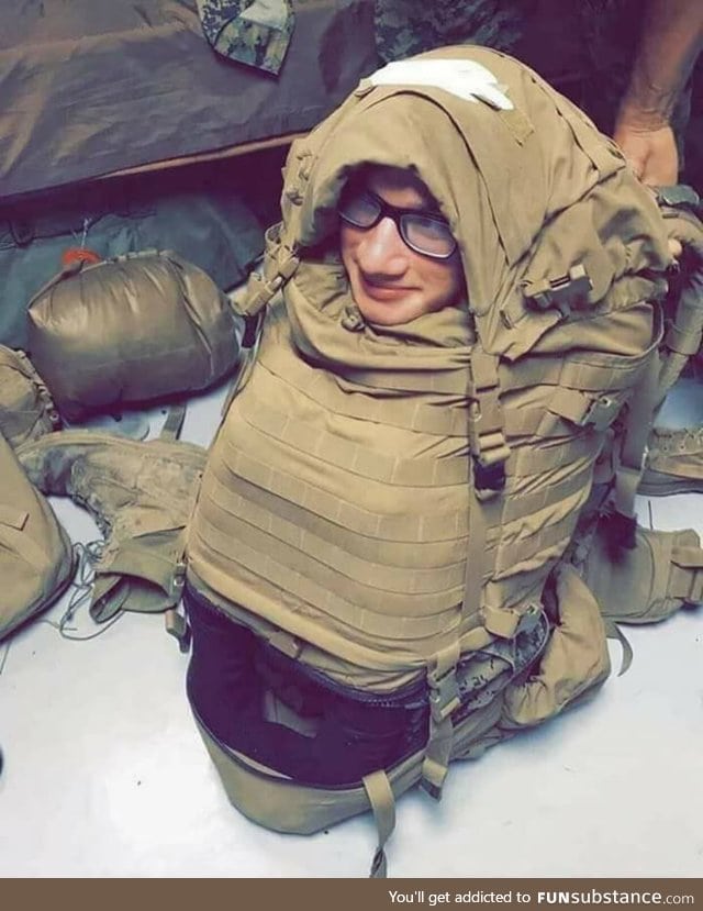 U.S Marine stuffed into a backpack