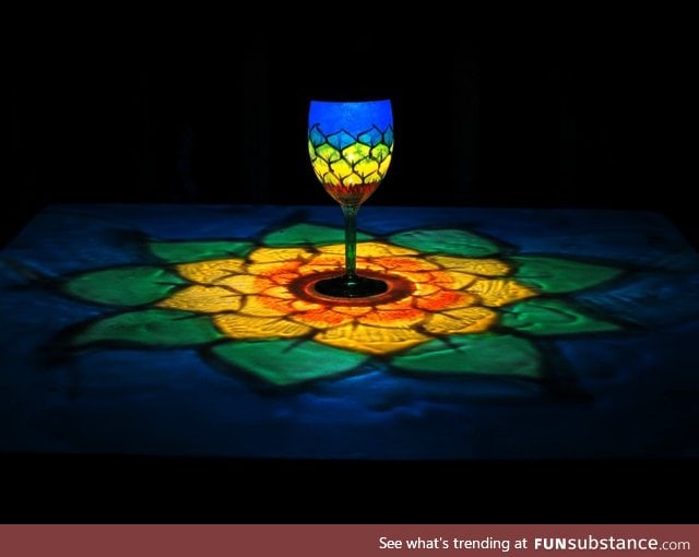 Light through a hand painted wine glass