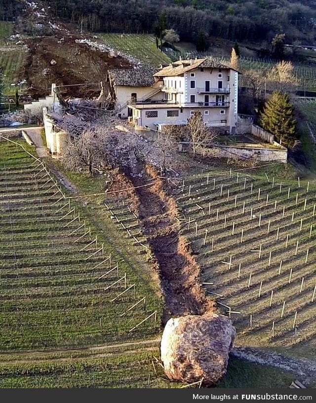 The aftermath of a boulder that rolled through a house in Italy