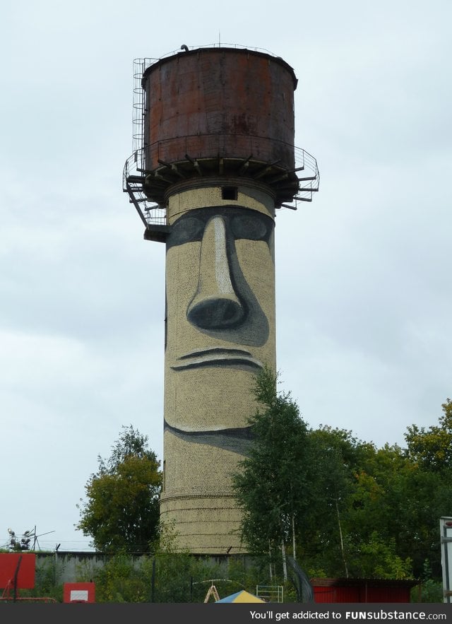 Water tower painted to look like an Easter Island Moai