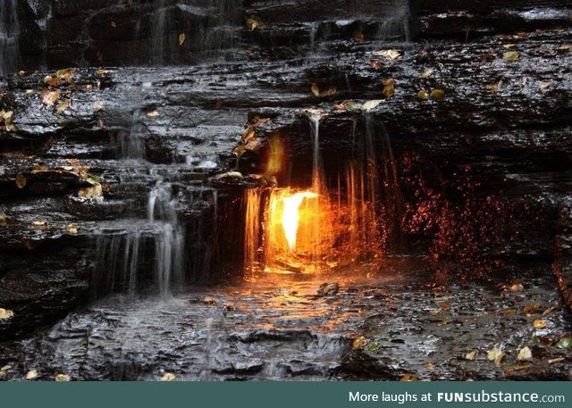 ‘Eternal Flame Falls’ a natural gas jet behind the waterfall burns perpetually