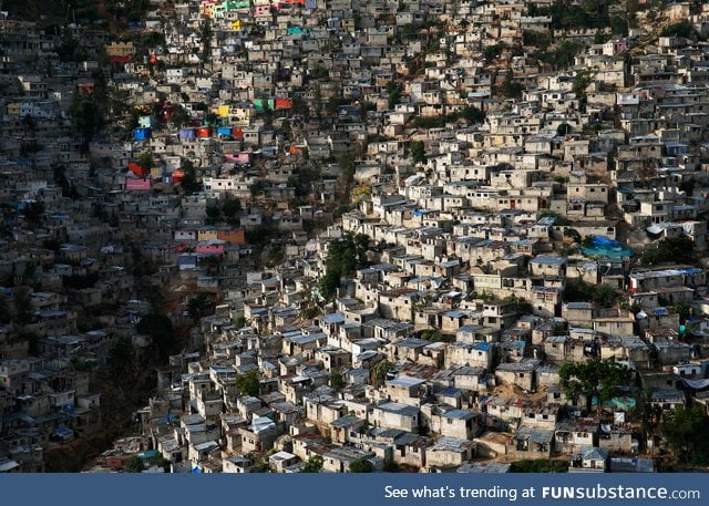 Large shanty town built onto a hillside in Haiti