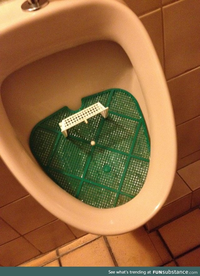 This urinal has a football minigame