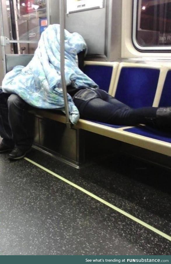 Caring boyfriend helps girlfriend to sleep on a train
