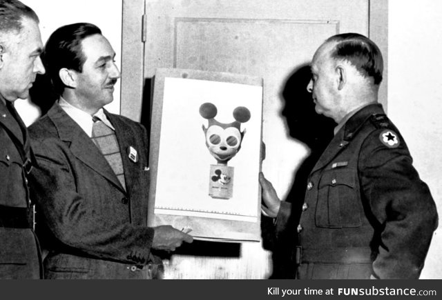 Walt Disney showing off the gas mask he designed for children during World War II