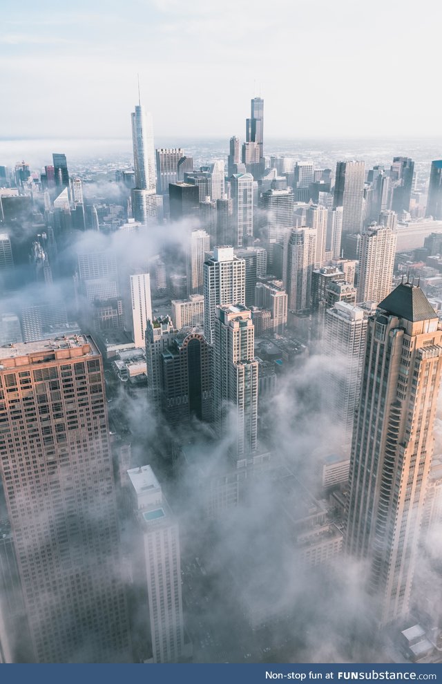 Chicago covered in clouds from 95 stories up.