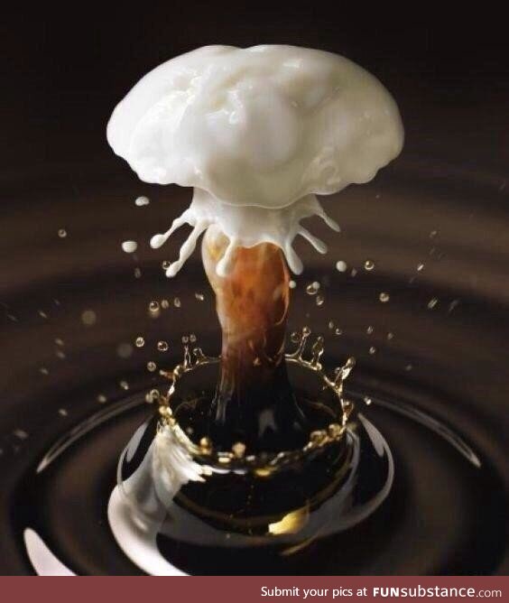 Drop of milk in coffee