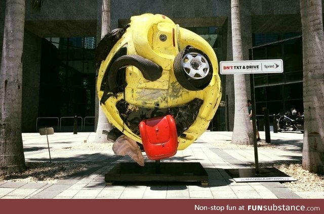 Artist Rudolf John, transformed a mangled car into an emoji as an anti texting