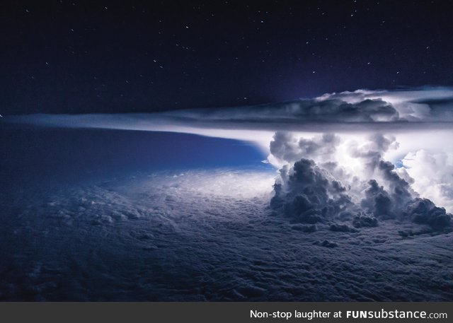 Thunderstorm above Pacific Ocean captured from a plane c*ckpit, by Santiago Borja