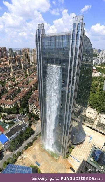 Waterfall building in China. NO PS. 121meters tall and the whole waterfall is 108 meters
