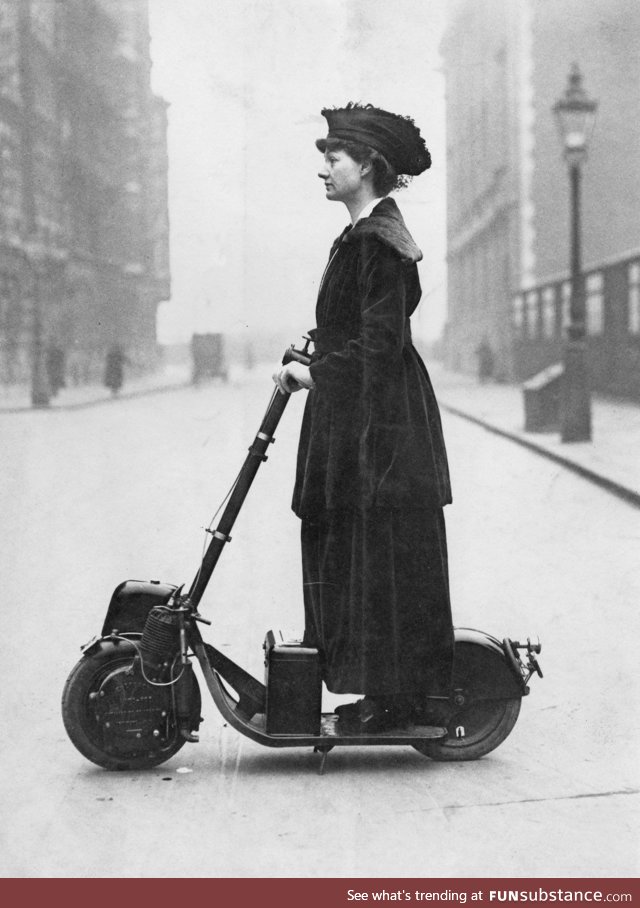 Lady Florence Norman, suffragette, going to work in London, on her electric scooter