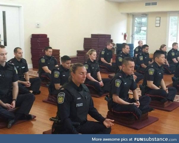 Canadian police officers meditating before they start their day