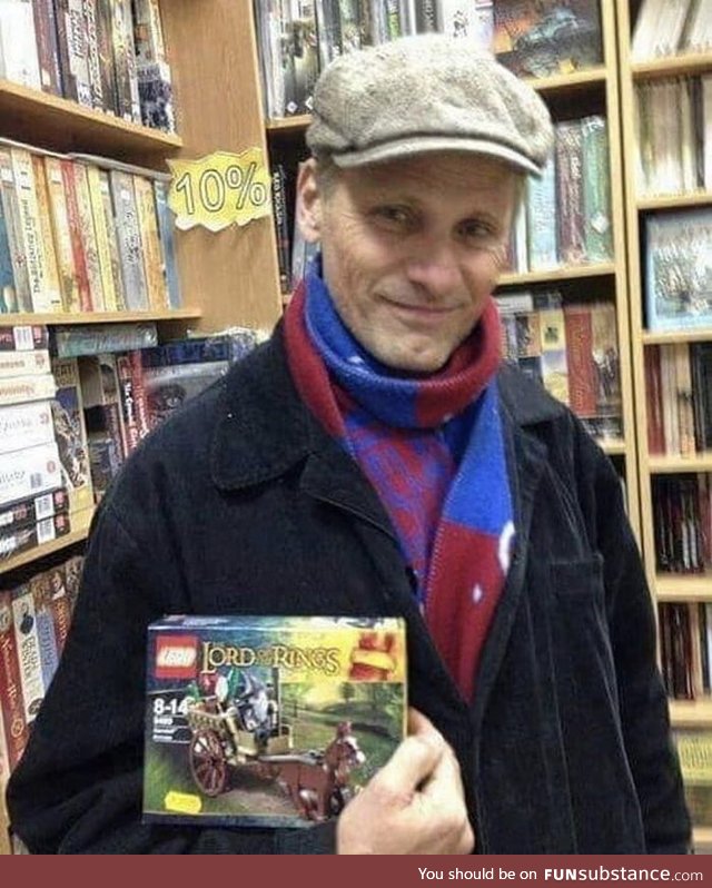 Here's a wonderful picture of Viggo in a bookstore holding a Lego set