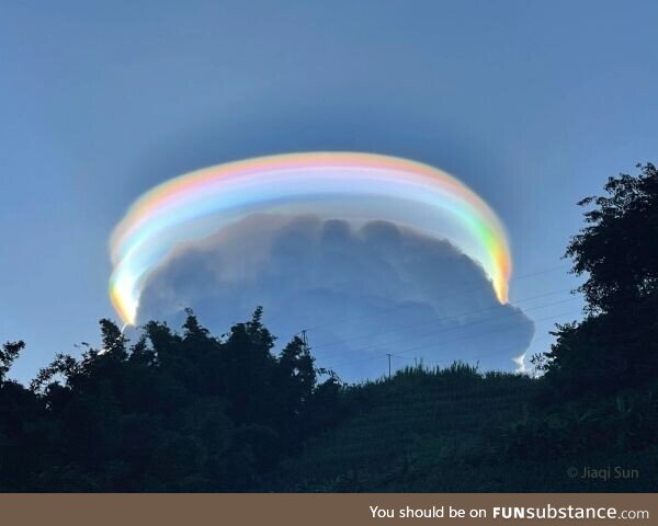 An iridescent pileus cloud over China