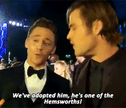 Tom looks so honored, like "Yes I am a Hemsworth now!"