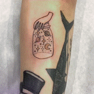 UV light space in a jar tattoo
