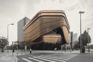 Bronze tubes curtain-like facade of the arts and culture centre in Shanghai