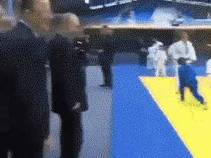 Vladimir Putin demonstrates Judo technique to young boy who follows his advice