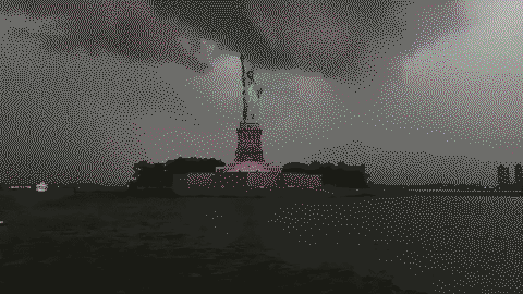 Lightning bolt nearly strikes the Statue of Liberty as a storm passes over New York City