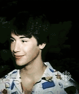 Young Keanu Reeves smiling