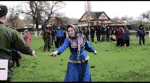 Russian girl swinging Shashka swords in traditional dance