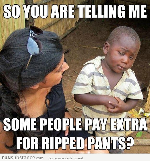 Skeptical 3rd world kid on ripped jeans