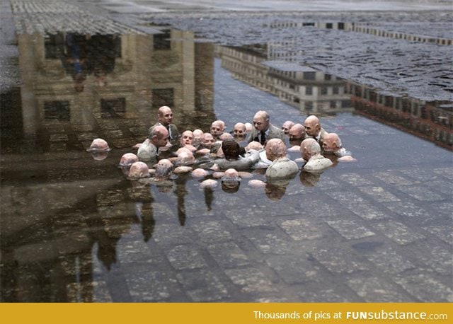 Isaac Cordal sculpture depicting politicians discussing global warming