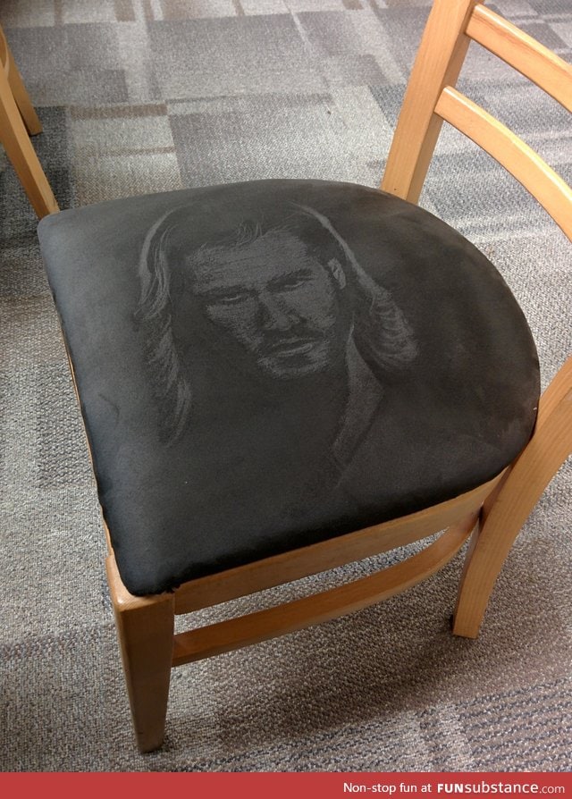 Someone drew Thor on a suede chair