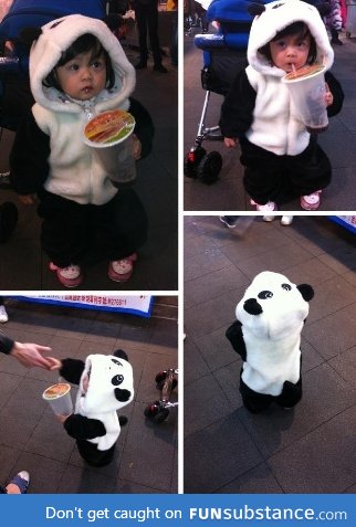 Little girl showing off her panda outfit