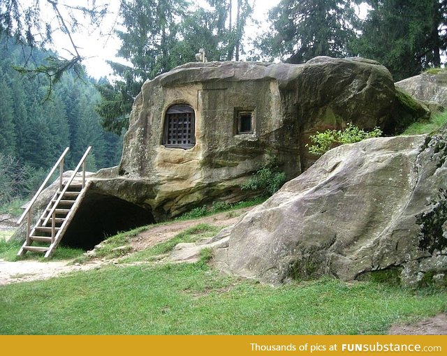 House carved into a stone by a 15th century Romanian monk