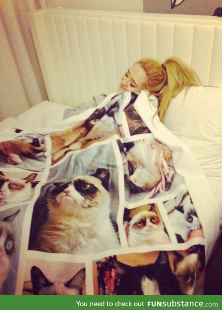 Sometimes happiness means snuggling with a grumpy cat blanket