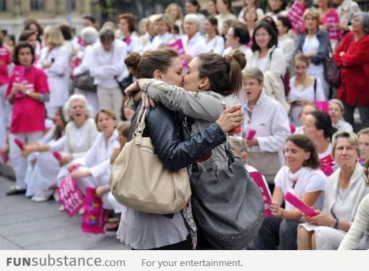 Brave lesbians kissing during a homophobic event